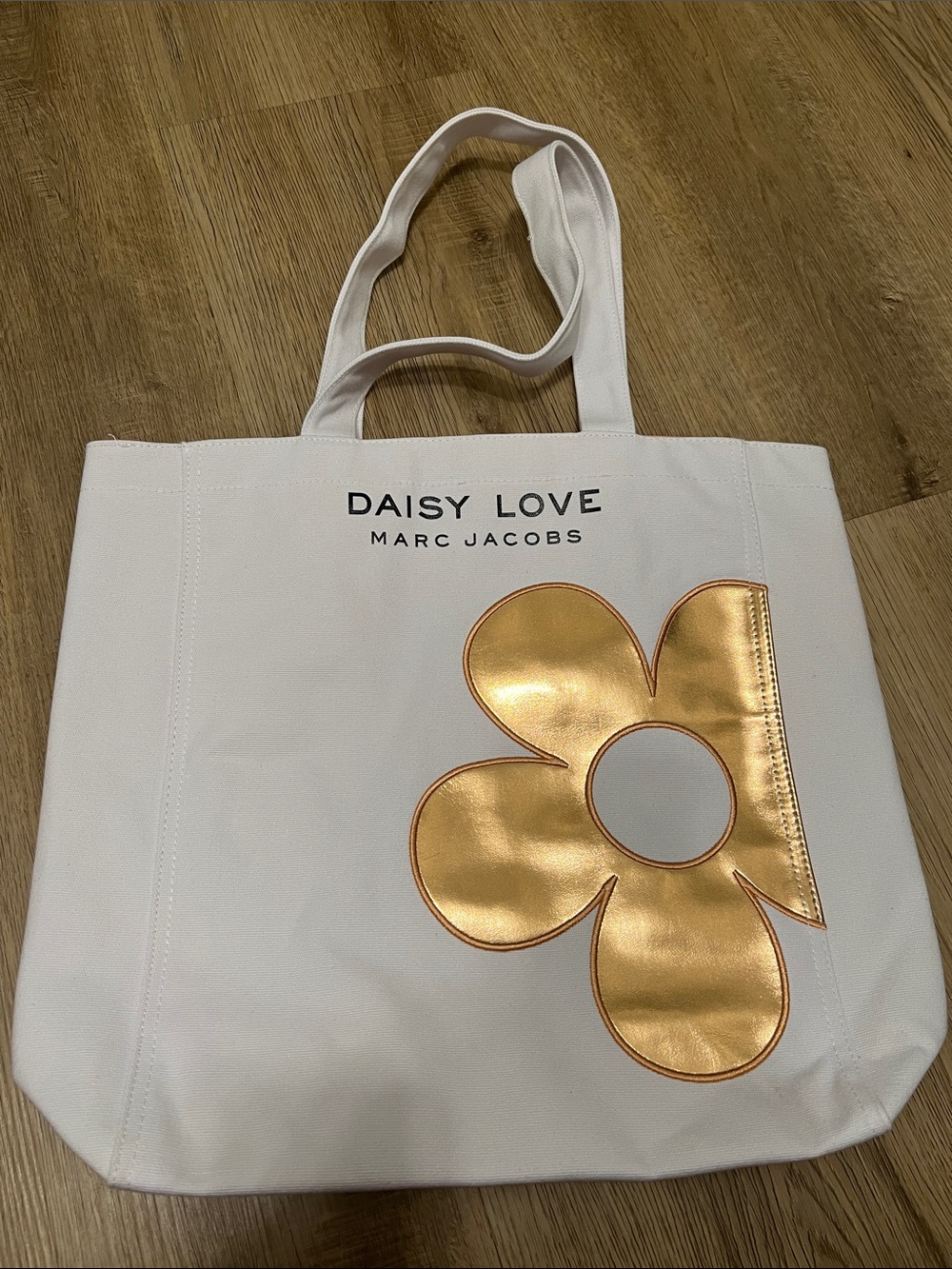Marc Jacobs White Tote with Metallic Gold Daisy Accent